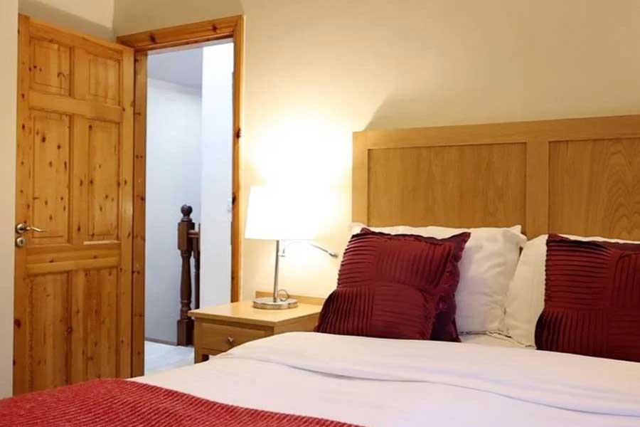 Slaapkamer 3-Kamer cottage Ryans Retreats